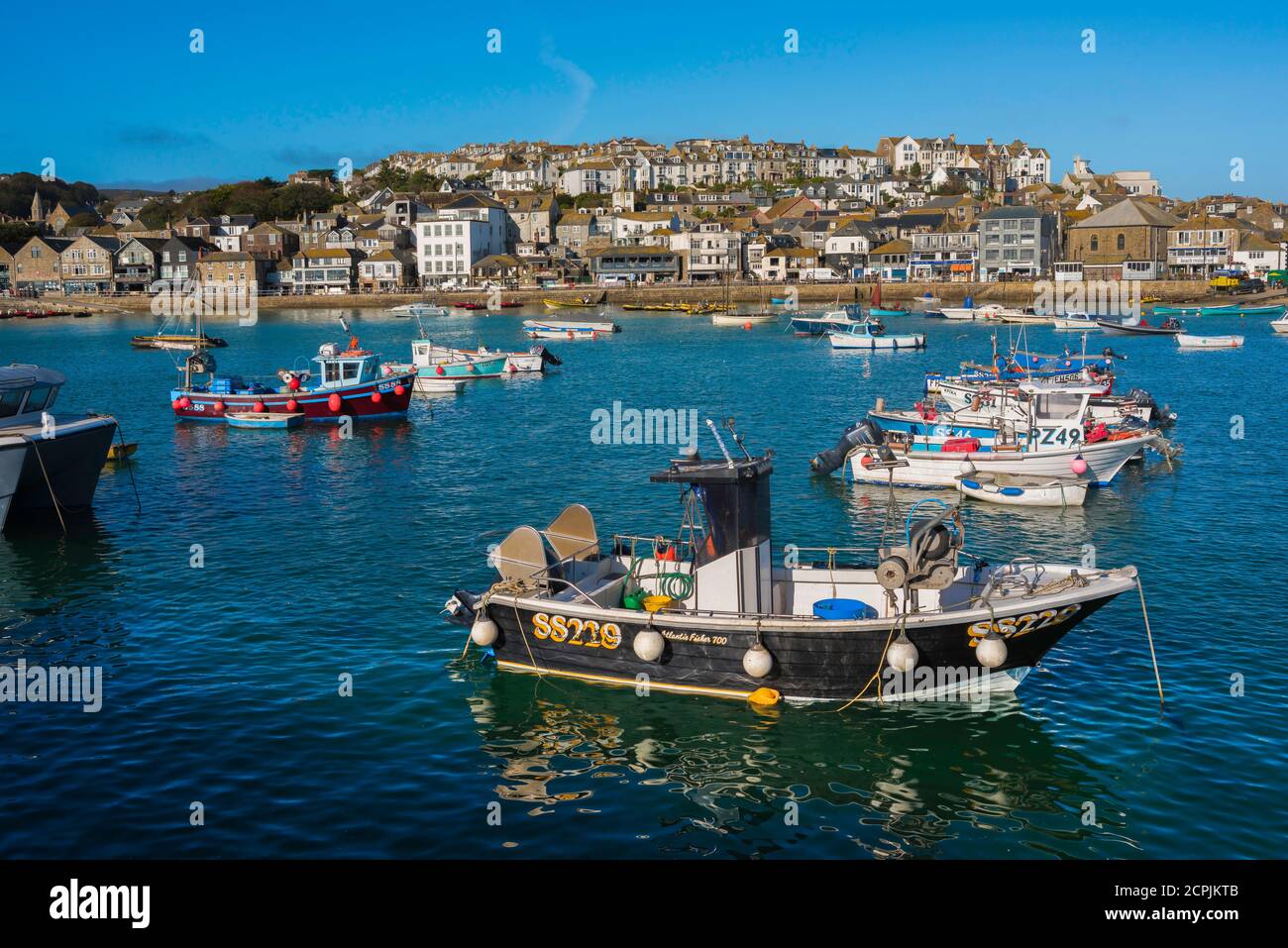 UK fishing town, view in summer of fishing boats moored in St Ives harbour, Cornwall, south west England, UK Stock Photo