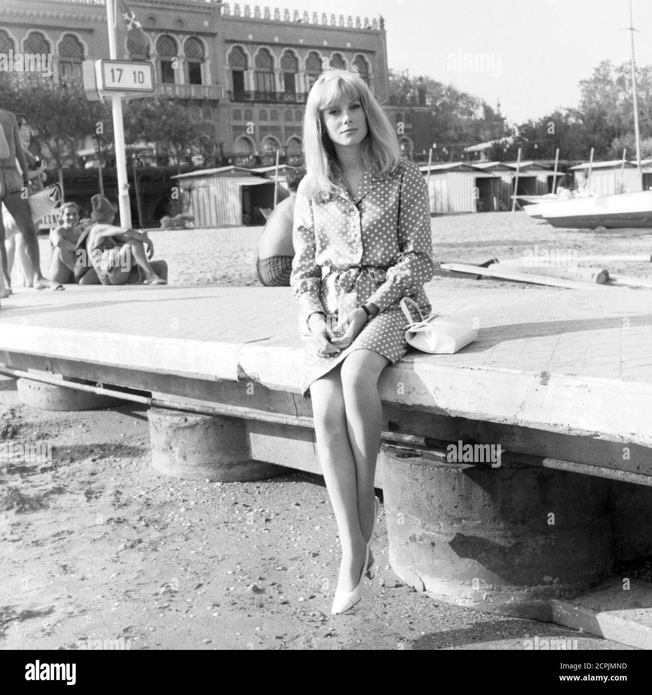 Actress Catherine Deneuve at the beach at the 27th edition of the Venice International Film Festival, Venice, September 1966 Stock Photo