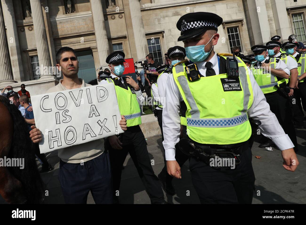 Police presence at an anti-vax protest in London's Trafalgar Square. Stock Photo