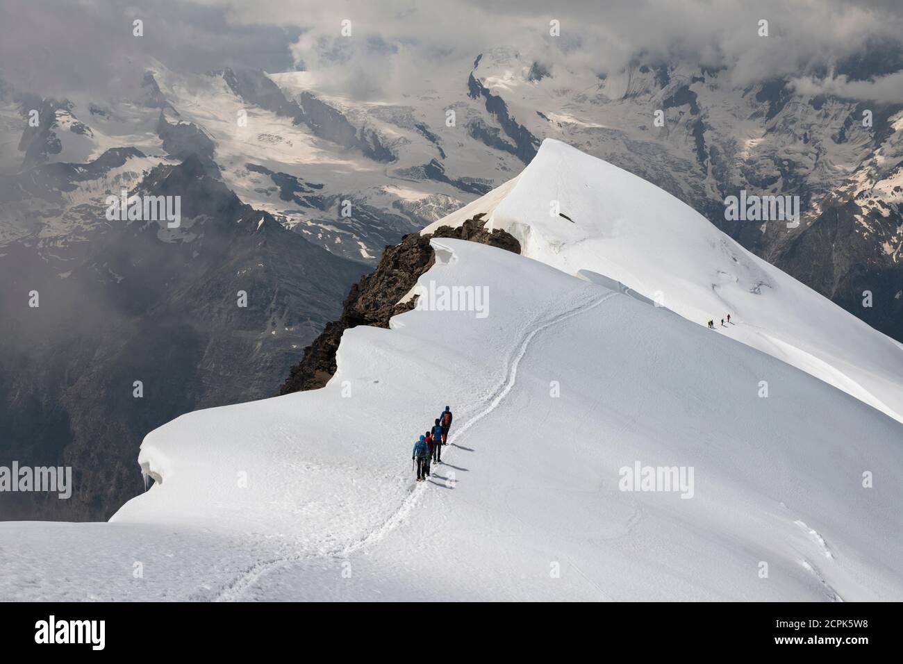 Switzerland, Canton of Valais, Saas Valley, Saas-Grund, mountaineers descending Weissmies west ridge Stock Photo