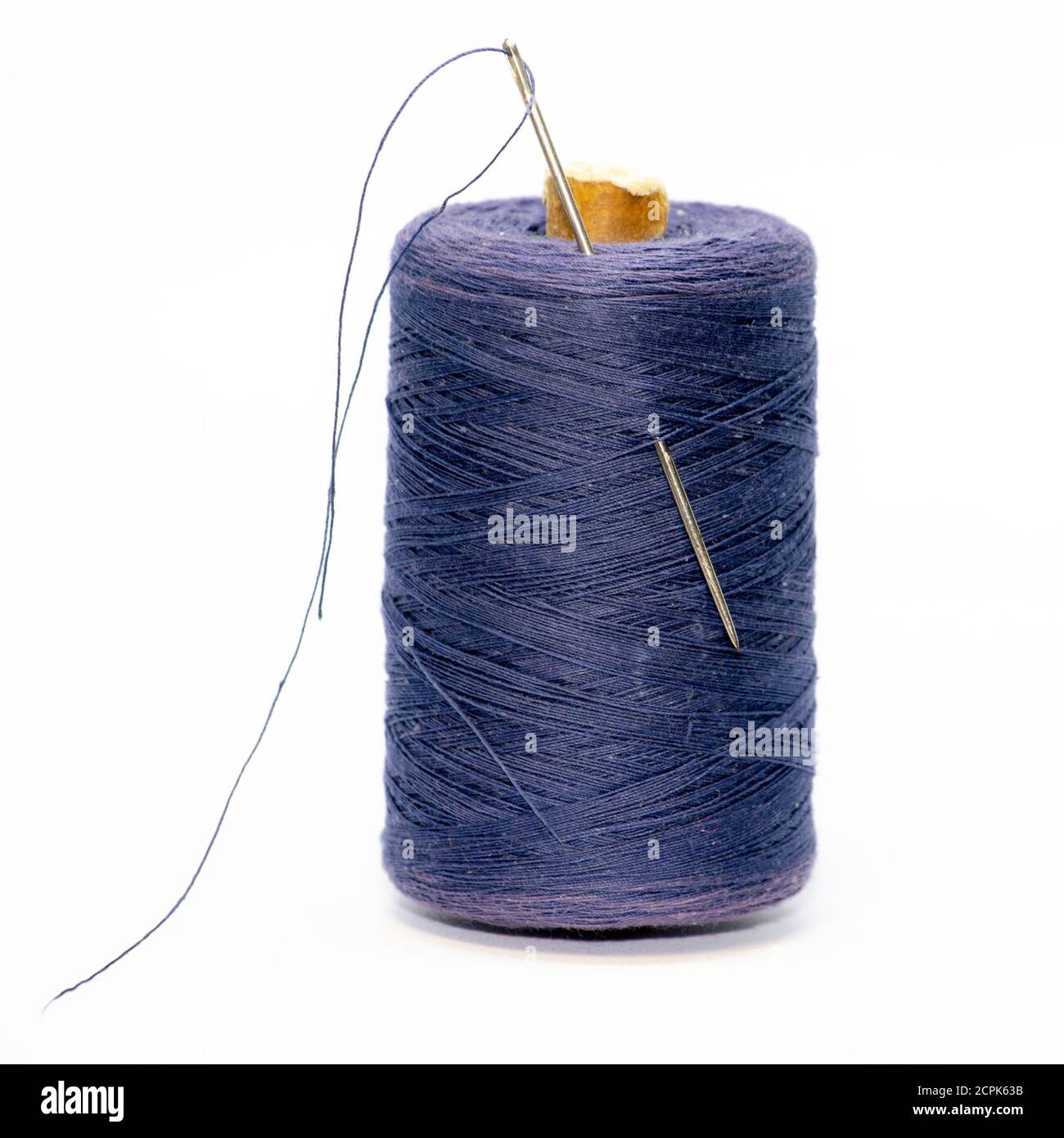 Spool of thread with needle isolated on white Stock Photo - Alamy