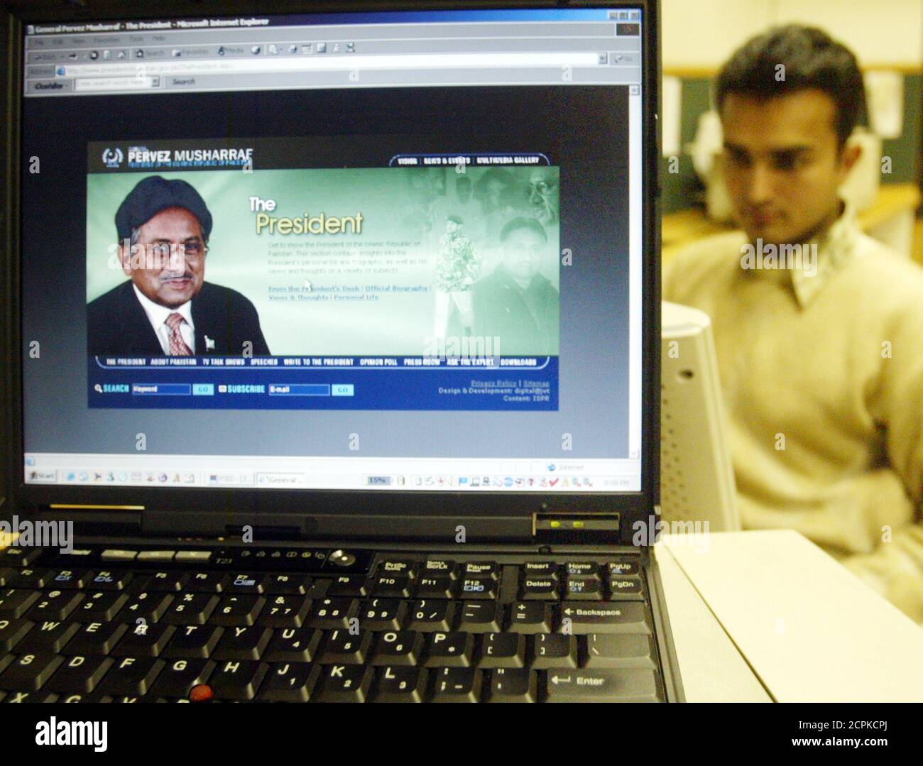 A man browses the official website of the Pakistani President Pervez Musharraf on the internet in Islamabad.  A man browses the official website of the Pakistani President Pervez Musharraf on the internet in Islamabad, February 24, 2005. Only the war with India in 1965 saved Pakistan's President Musharraf from being court martialled. This story of his early brush with authority is how Musharraf opens an account of his personal and professional life in a letter posted on his official website which was launched on Thursday. REUTERS/Mian Khursheed Stock Photo