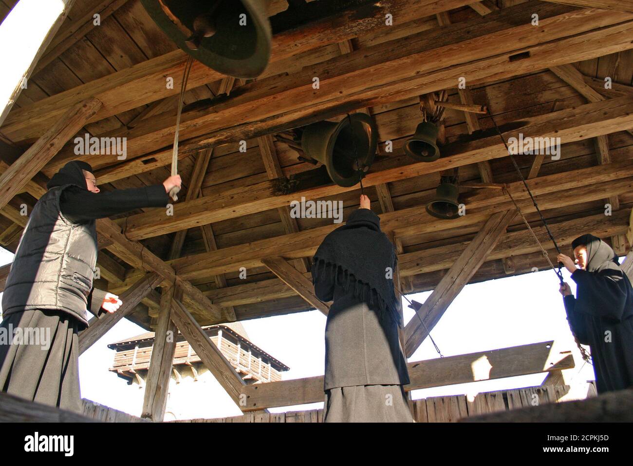 Nuns ringing the bells at Humor Monastery, Romania Stock Photo - Alamy