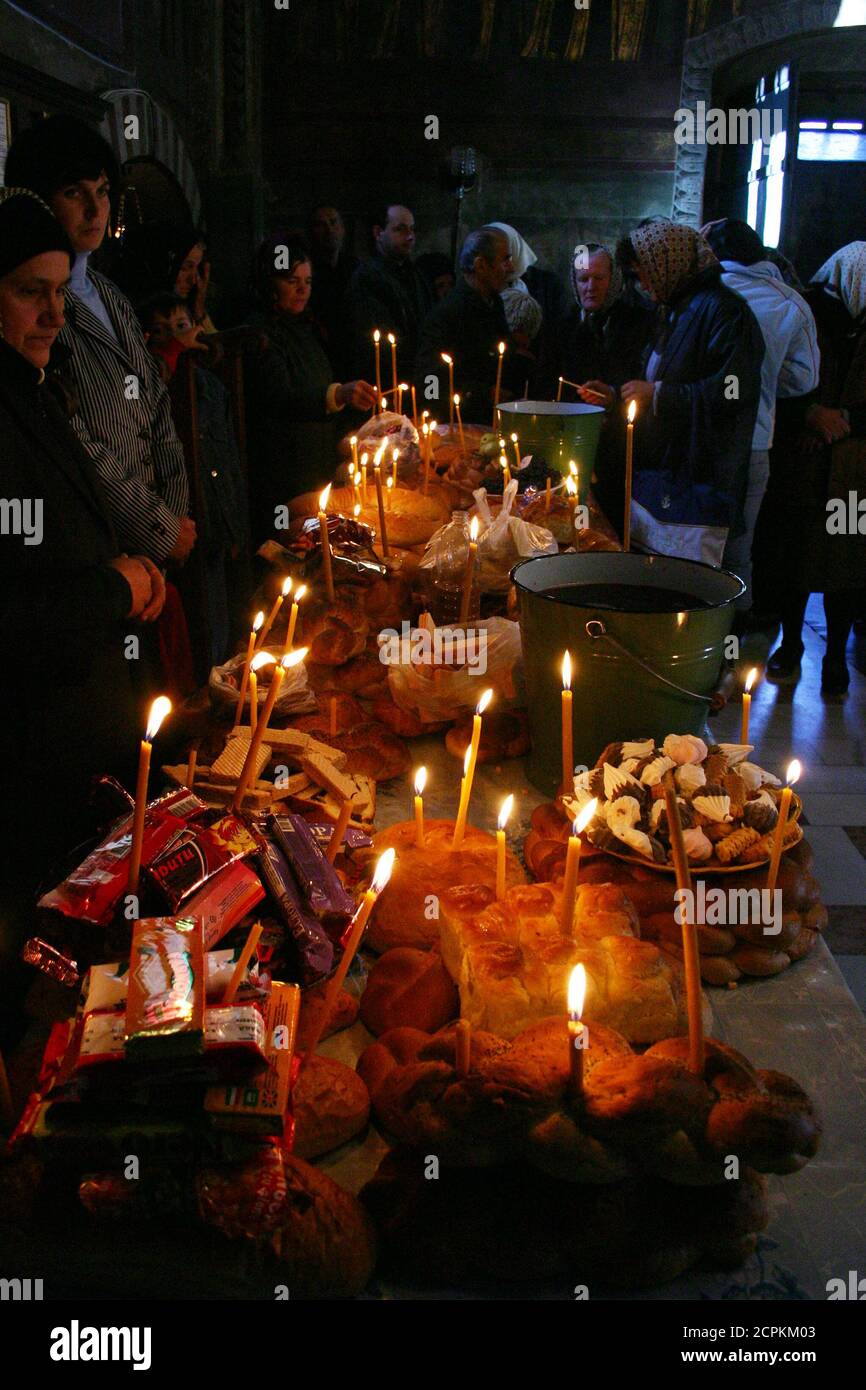 Food, wine and burning candles for the soul of the dead ones- religious ...