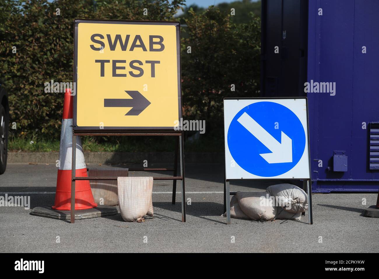 Signs for a coronavirus testing station at the AJ Bell Stadium in ...