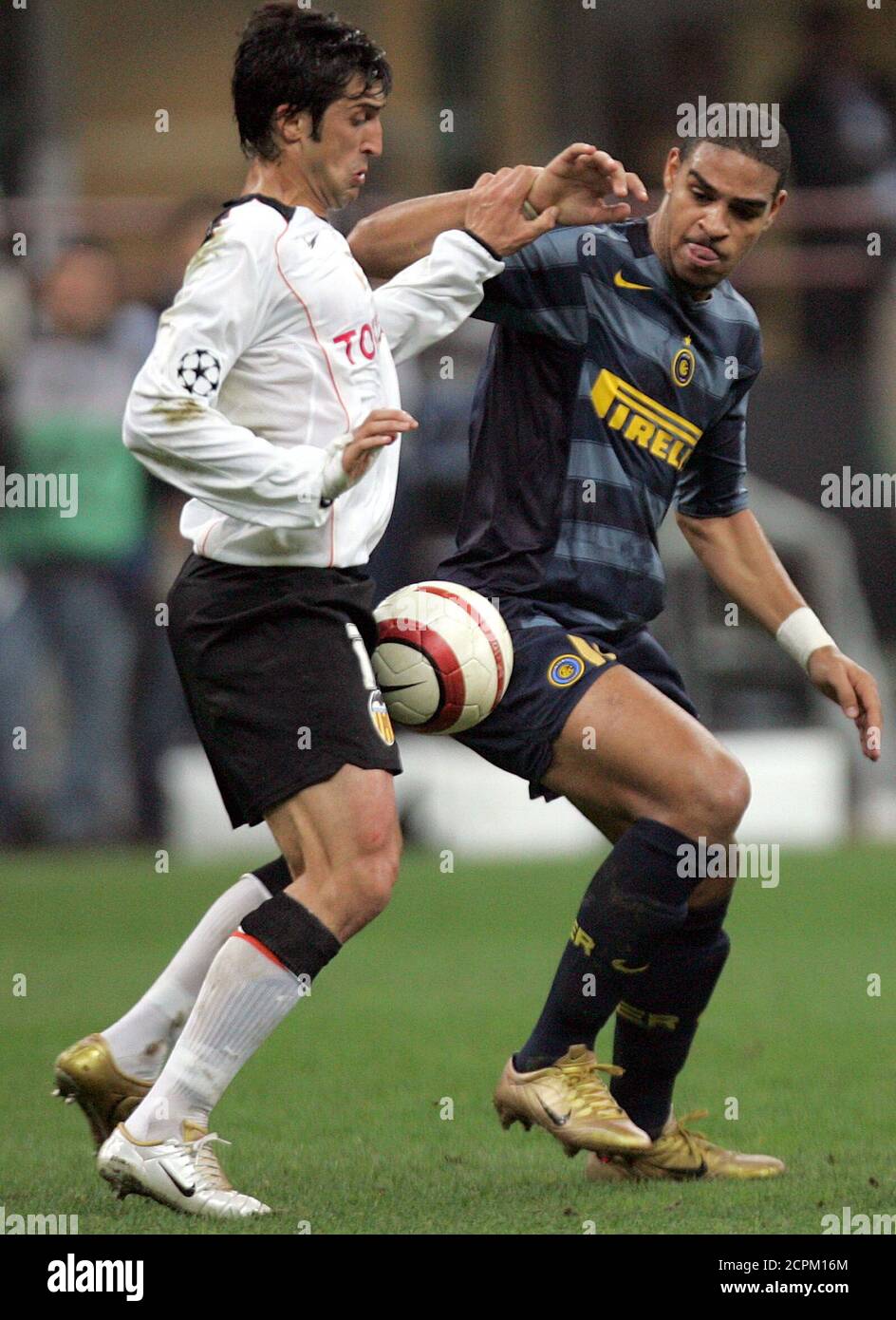 Inter Milan's Adriano (R) challenges Marco Caneira of Valencia during their  Champions League Group G match