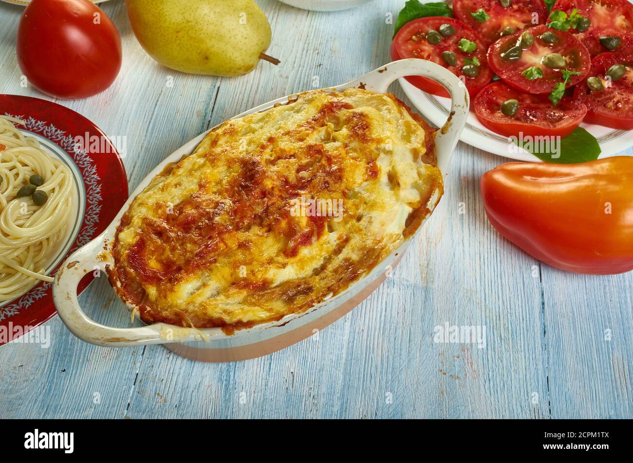 Gatto' di patate con ragu, potato with meat casserole, Sicilian cuisine, Traditional assorted Italy dishes, Top view. Stock Photo