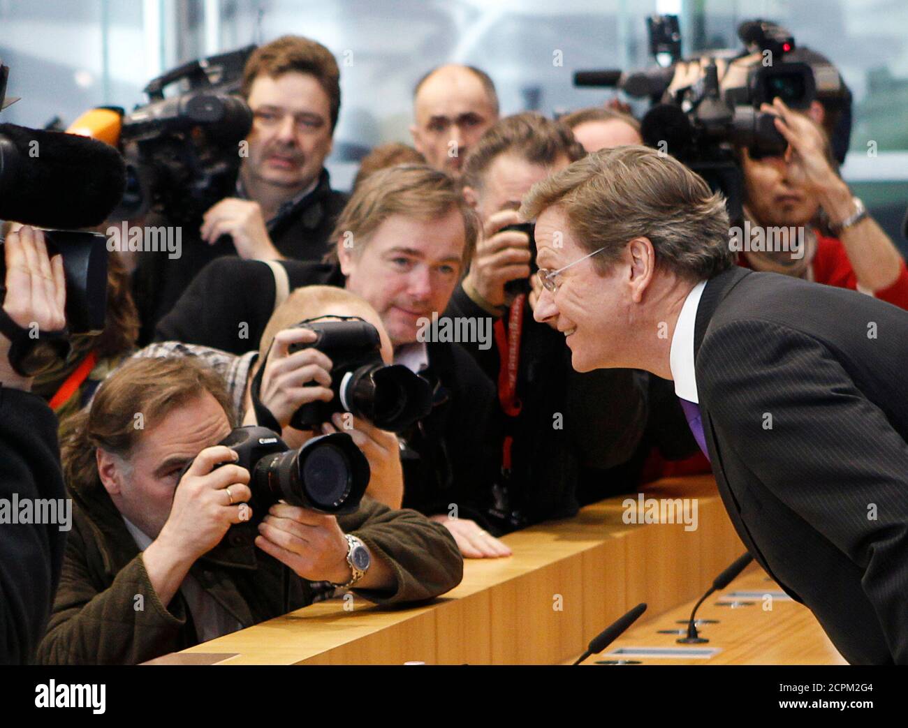 Germany's Foreign Minister Guido Westerwelle poses for the media as he arrives for a news conference at the Bundespressekonferenz in Berlin February 26, 2010.  REUTERS/Thomas Peter (GERMANY - Tags: POLITICS) Stock Photo