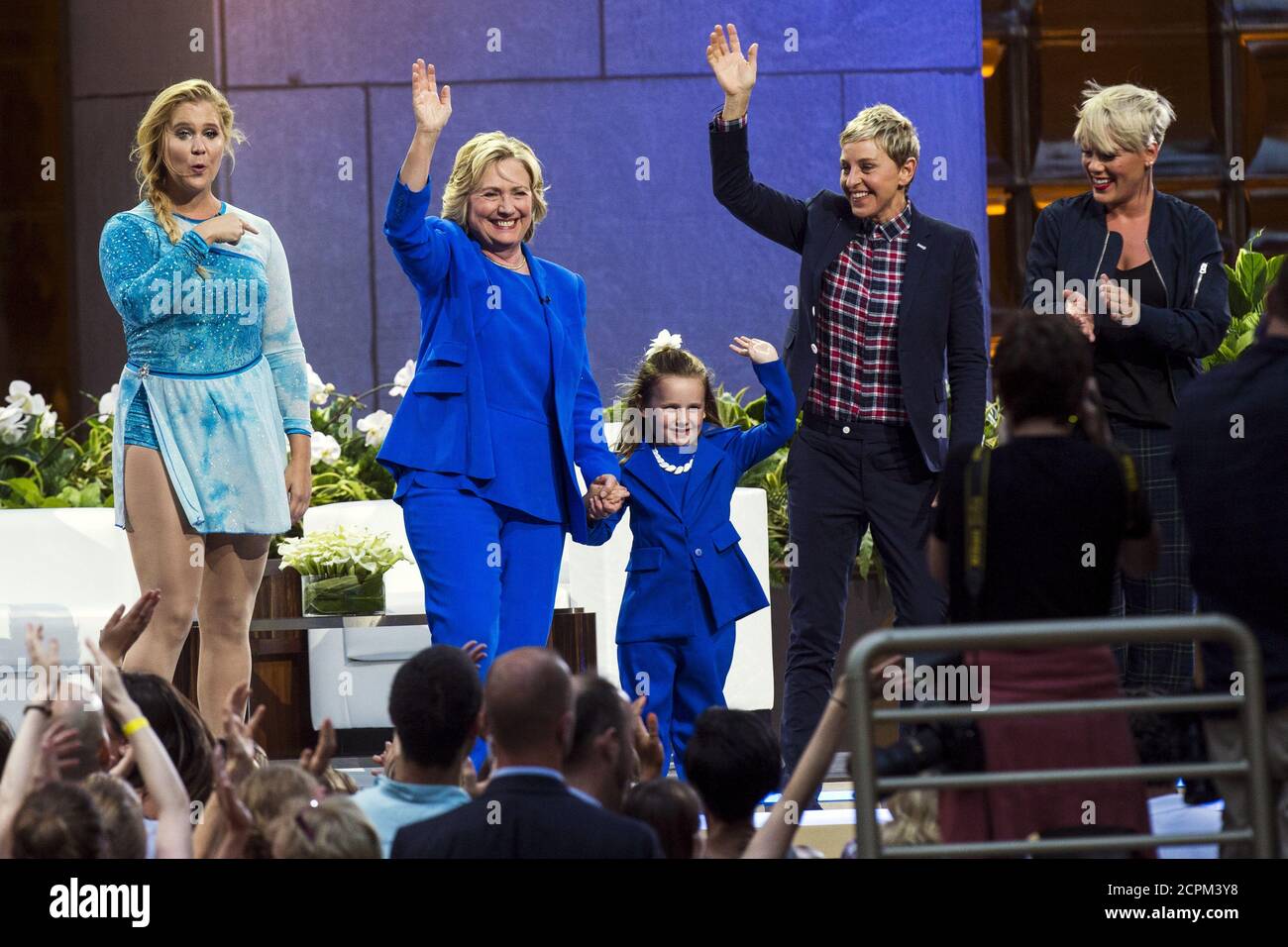 U.S. Democratic presidential candidate Hillary Clinton (2nd L) waves with  (L-R) comedian Amy Schumer, 5-year-old presidential expert Macey Hensley,  television host Ellen DeGeneres, and singer Pink during a taping of "The  Ellen