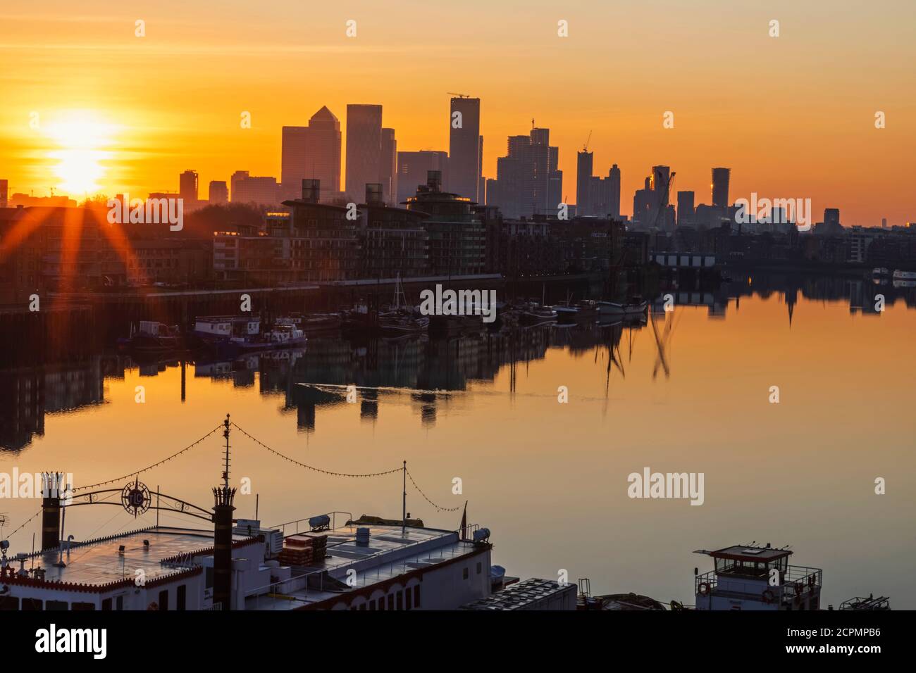 England, London, Docklands, River Thames and Canary Wharf, Skyline and Rainbow Stock Photo