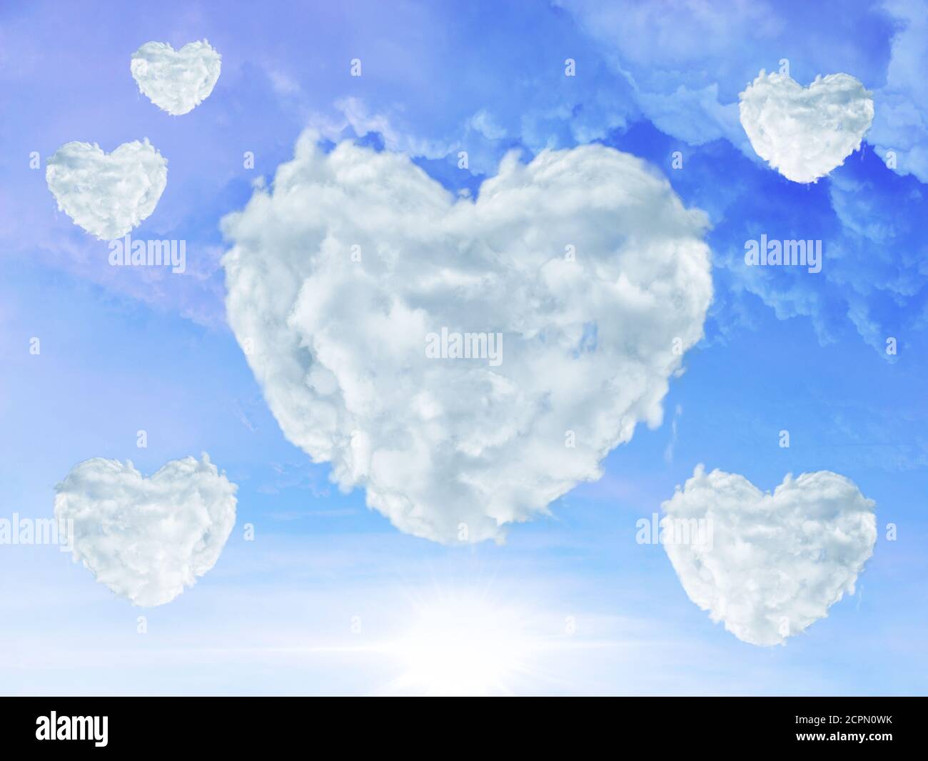 blue sky with clouds shaped as heart. Love concept Stock Photo - Alamy