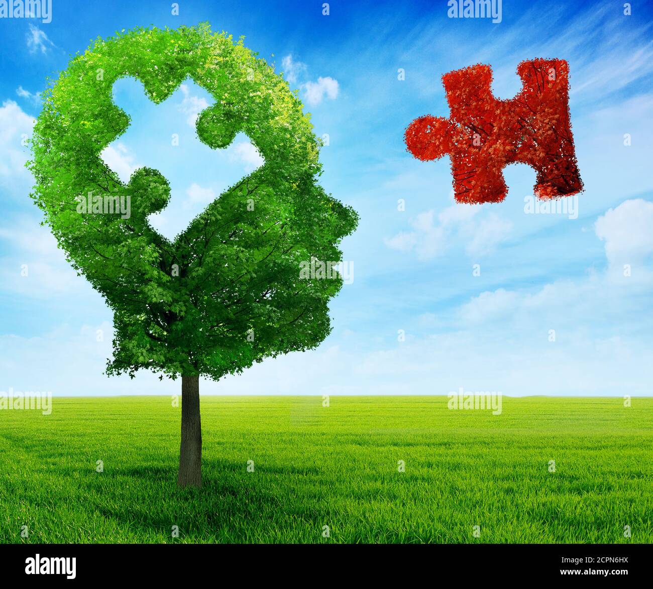 Puzzle head brain mental health symbol concept. Tree in a shape of human head face profile with jigsaw piece cut out on blue sky background. Stock Photo