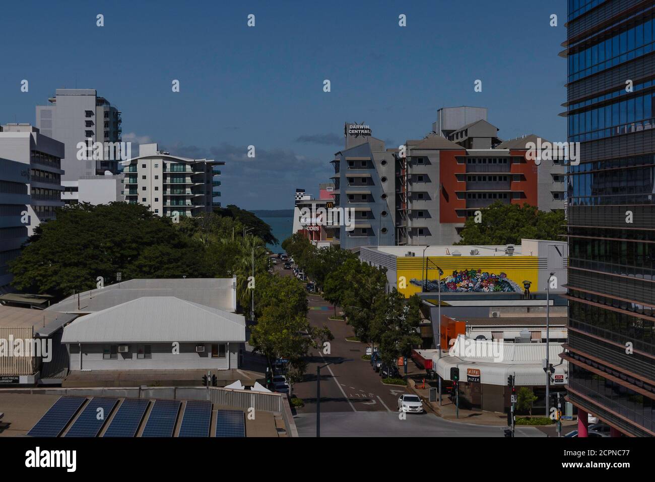Darwin, Australia - March 14th, 2020: A panoramic view of a main street leading to the ocean in Darwin, Australia, on a sunny day. Stock Photo