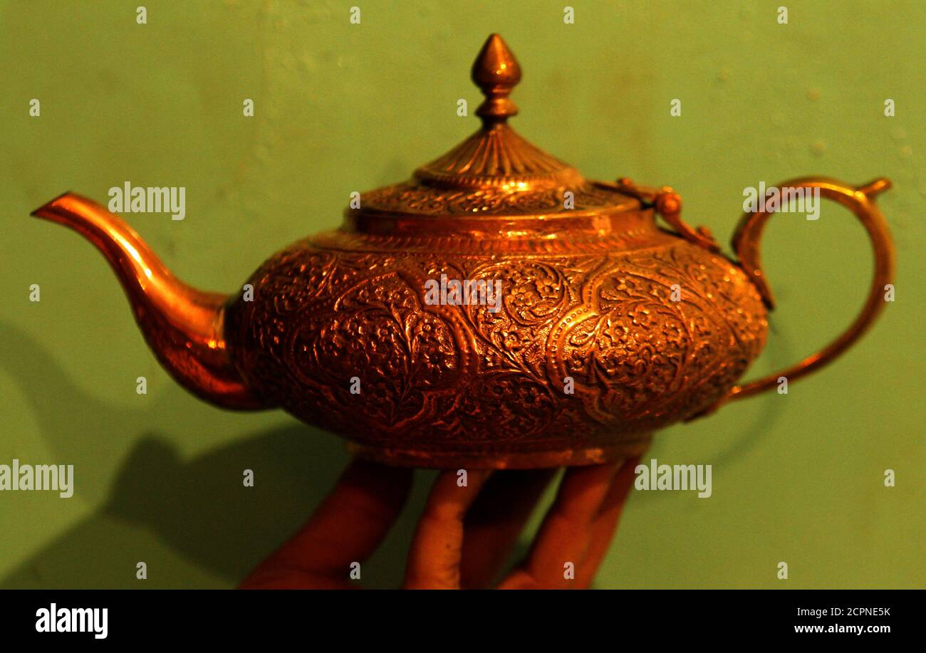 A copper teapot is shown by a salesman at a shop in Peshawar, Pakistan  October 23, 2017. REUTERS/Fayaz Aziz Stock Photo - Alamy