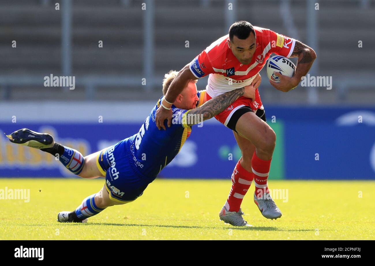 St Helens' Zeb Taia is tackled by Warrington Wolves Blake Austin during the Betfred Super League match at the AJ Bell Stadium, Salford. Stock Photo
