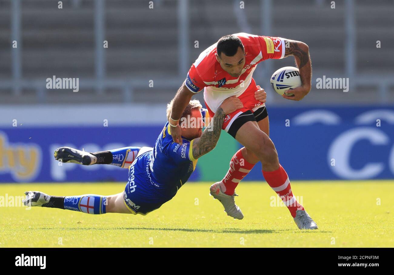 St Helens' Zeb Taia is tackled by Warrington Wolves Blake Austin during the Betfred Super League match at the AJ Bell Stadium, Salford. Stock Photo