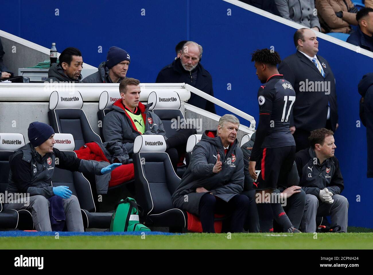 Soccer Football - Premier League - Brighton & Hove Albion vs Arsenal - The American Express Community Stadium, Brighton, Britain - March 4, 2018   Arsenal's Alex Iwobi with manager Arsene Wenger as he is substituted    REUTERS/Eddie Keogh    EDITORIAL USE ONLY. No use with unauthorized audio, video, data, fixture lists, club/league logos or 'live' services. Online in-match use limited to 75 images, no video emulation. No use in betting, games or single club/league/player publications.  Please contact your account representative for further details. Stock Photo