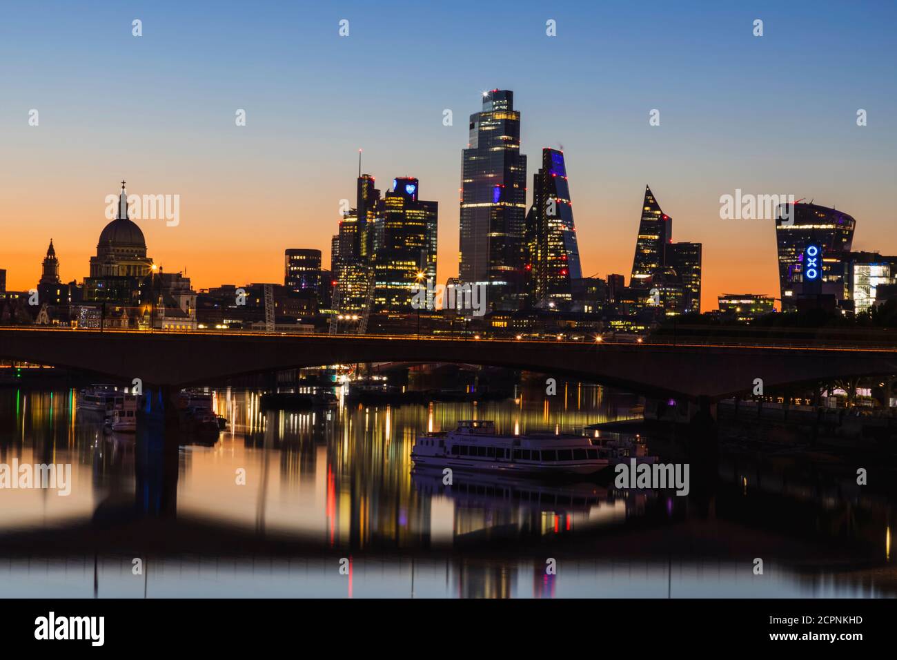 England, London, River Thames and City Skyline at Night Stock Photo