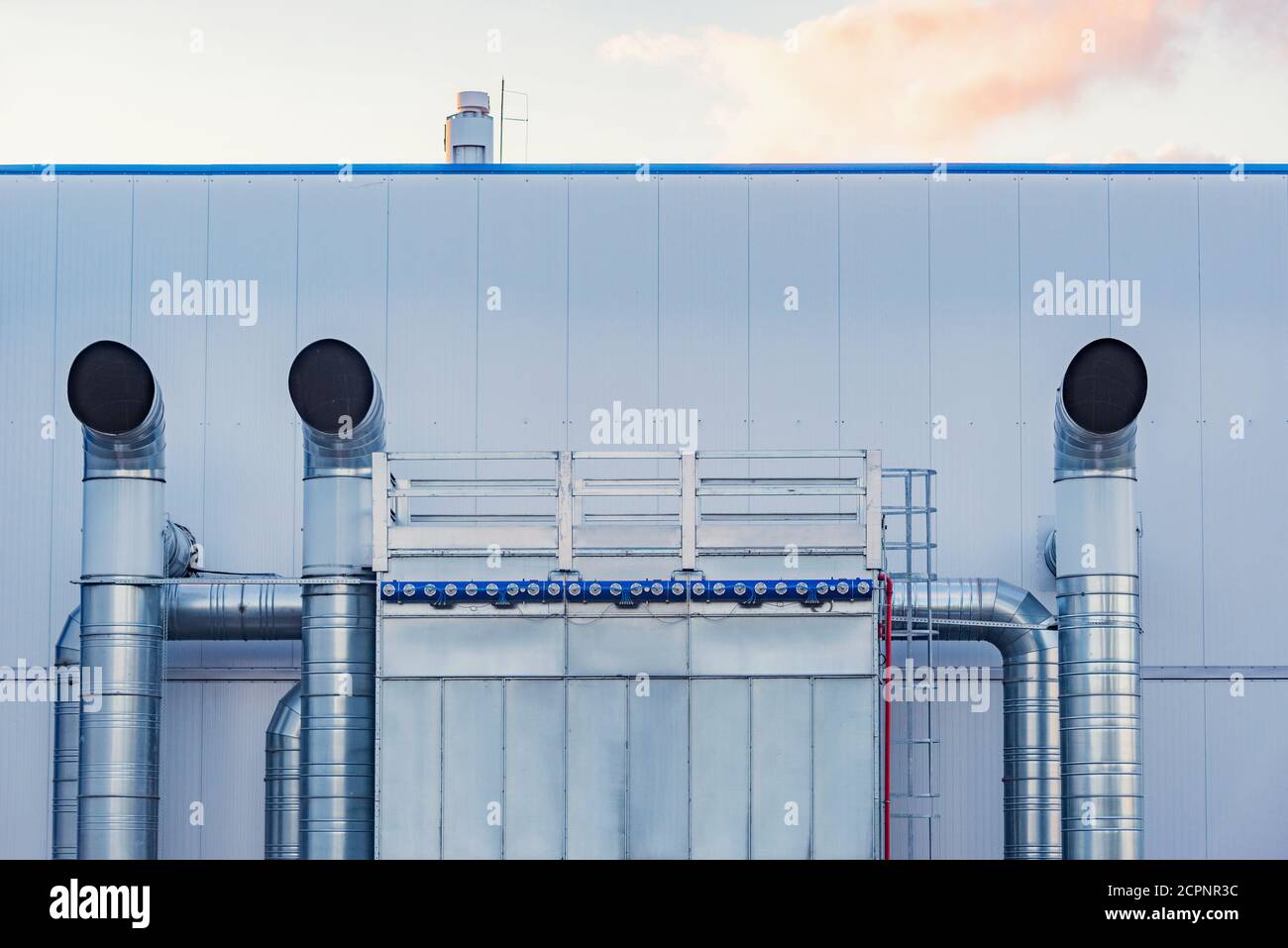 Pipes of the air conditioning system by the plant building Stock Photo