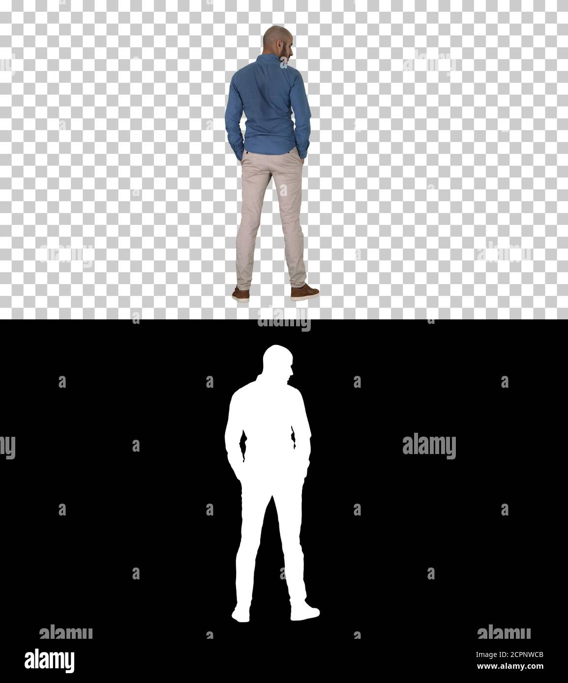 Arab in casual looking around with hands in pockets, Alpha Chann Stock Photo