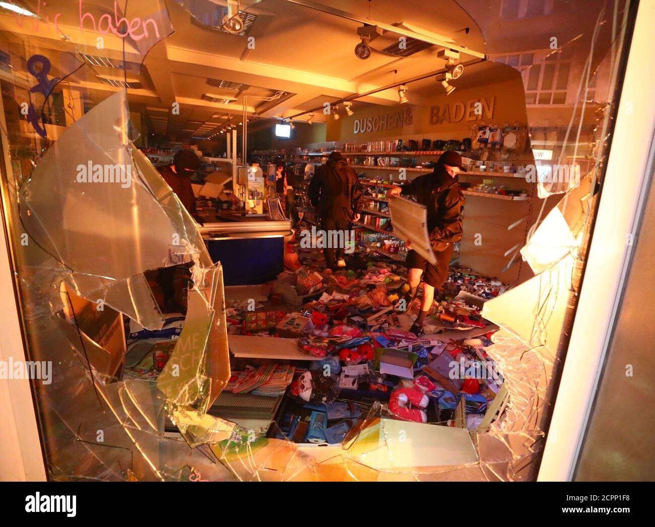 A shop is looted during anti-G20 protests on the first day of the G20 summit in Hamburg, Germany, July 7, 2017. REUTERS/Pawel Kopczynski Stock Photo