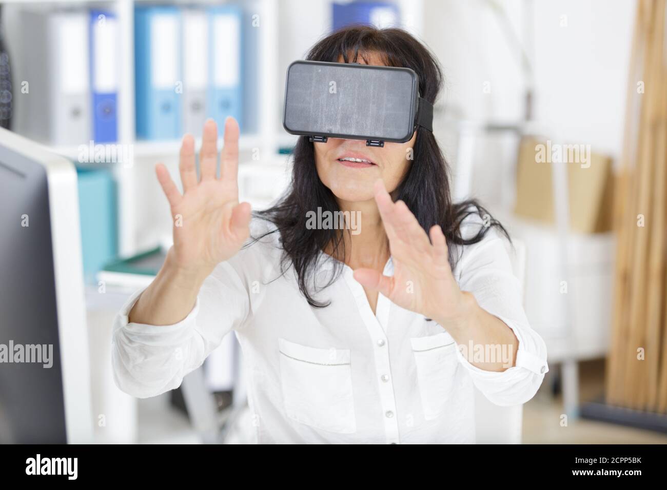 woman using laptop via virtual reality glasses Stock Photo