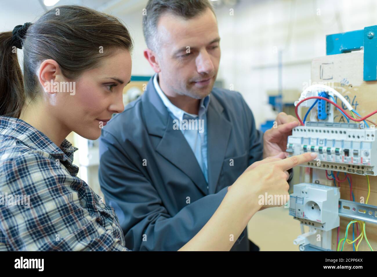 Woman Training To Learn How To Measure Electrical Current Stock Photo
