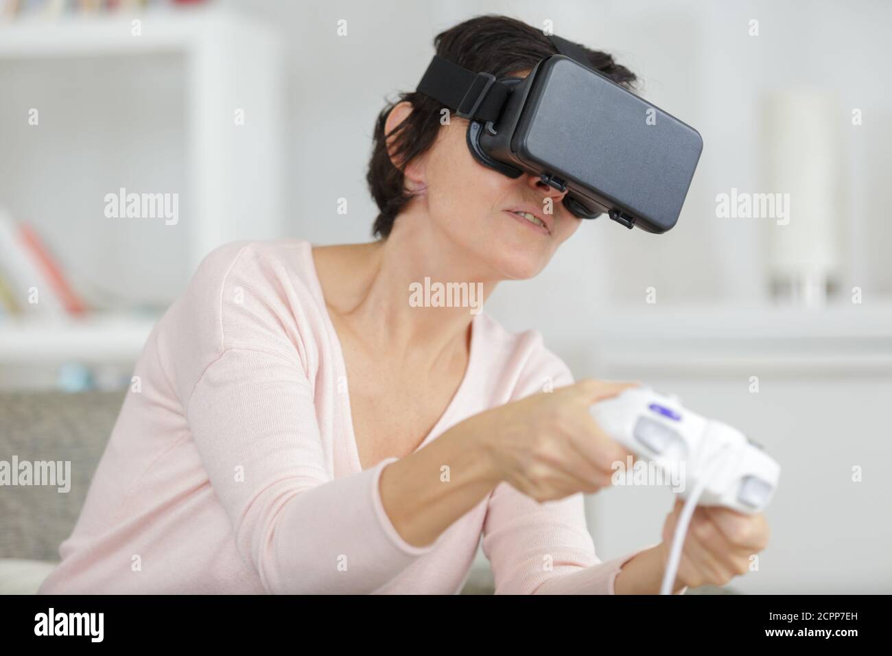 mature female student using virtual reality headset Stock Photo