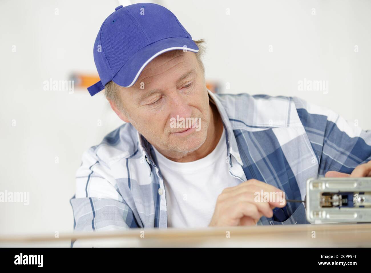 Worker Sawing Wood Electric Jigsaw Stock Photo Alamy