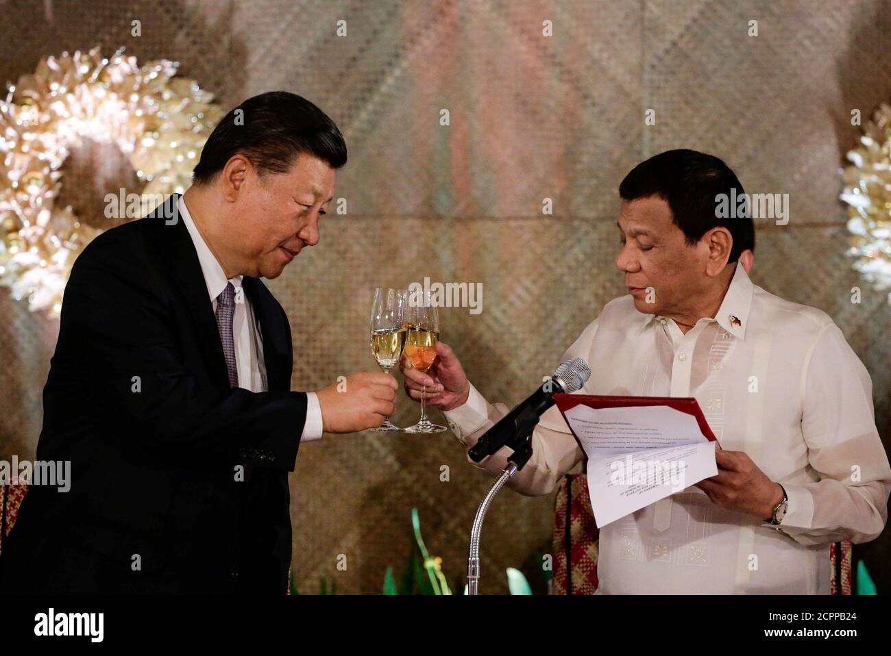 China's President Xi Jinping and Philippine President Rodrigo Duterte toast during a State Banquet at the Malacanang presidential palace in Manila, Philippines, November 20, 2018.   Mark Cristino/Pool via Reuters Stock Photo