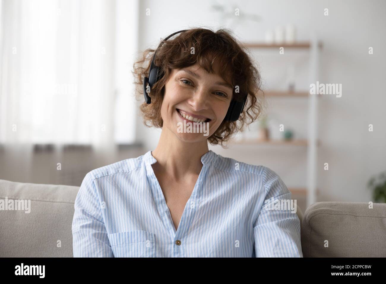 Portrait of young woman in headset talk on video call Stock Photo - Alamy