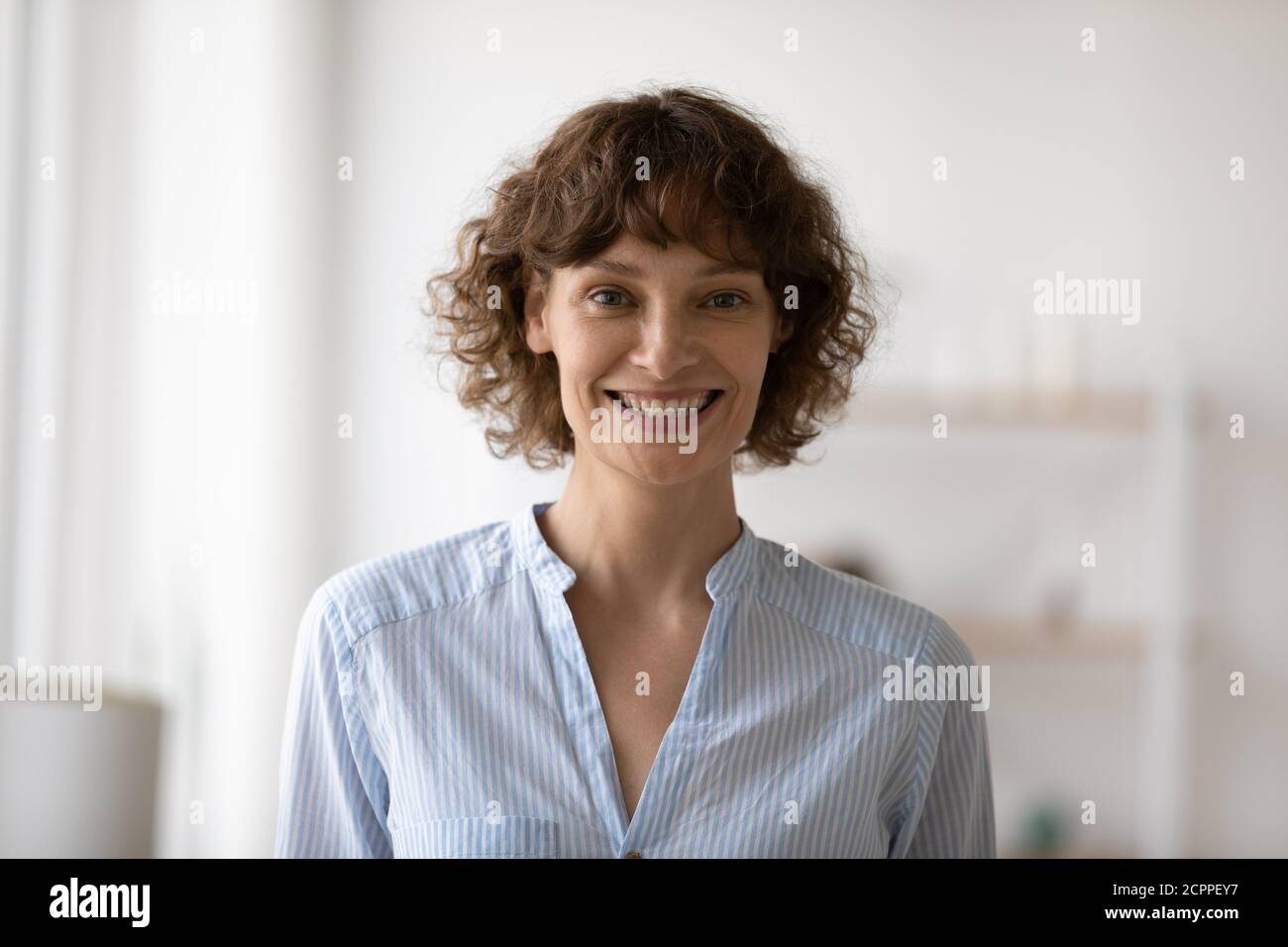 Headshot portrait of smiling 40s caucasian woman posing Stock Photo
