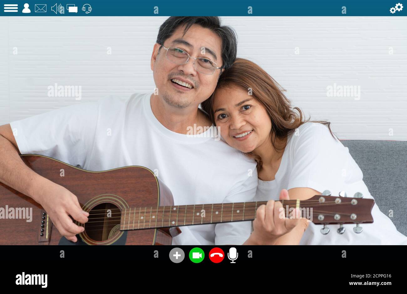 Happy senior people talking on internet video call at home while laughing with love . Online technology for mature parents . Webcam application in Stock Photo