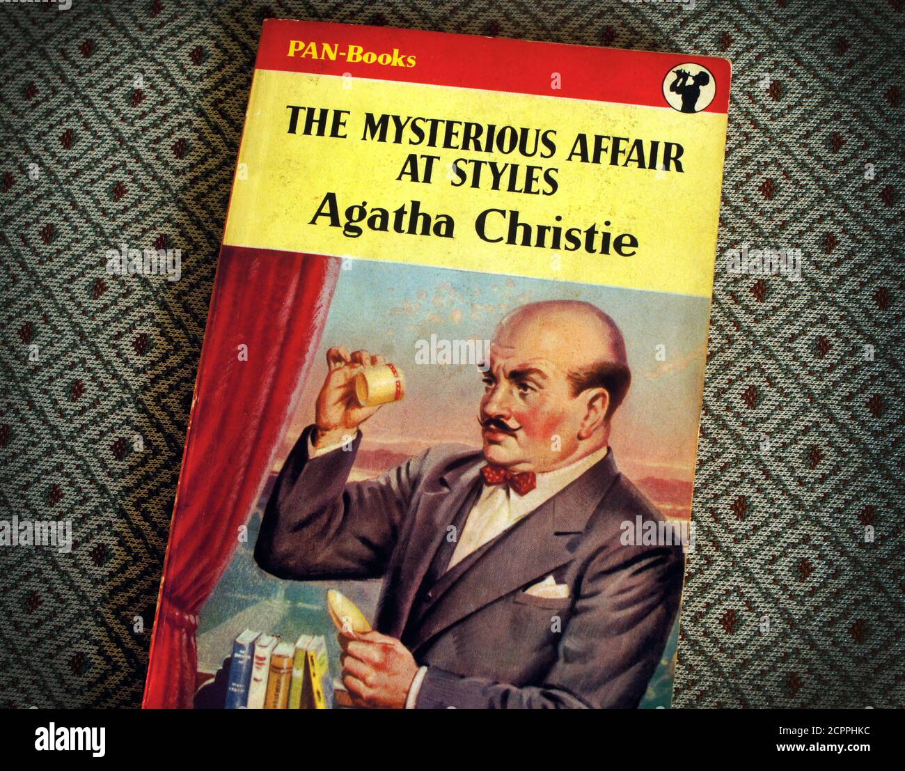 Second-hand vintage Agatha Christie paperback. The Mysterious Affair at Styles. Pan books 1950s cover featuring Poirot 100th Anniversary in 2020.. Stock Photo