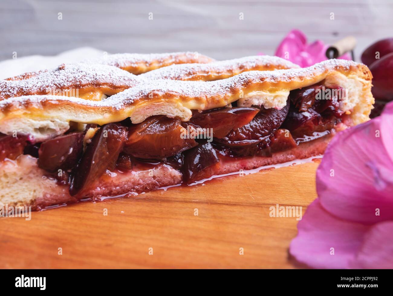 Yummy  delicious homemade pie cake with filling cut plum, close up Stock Photo