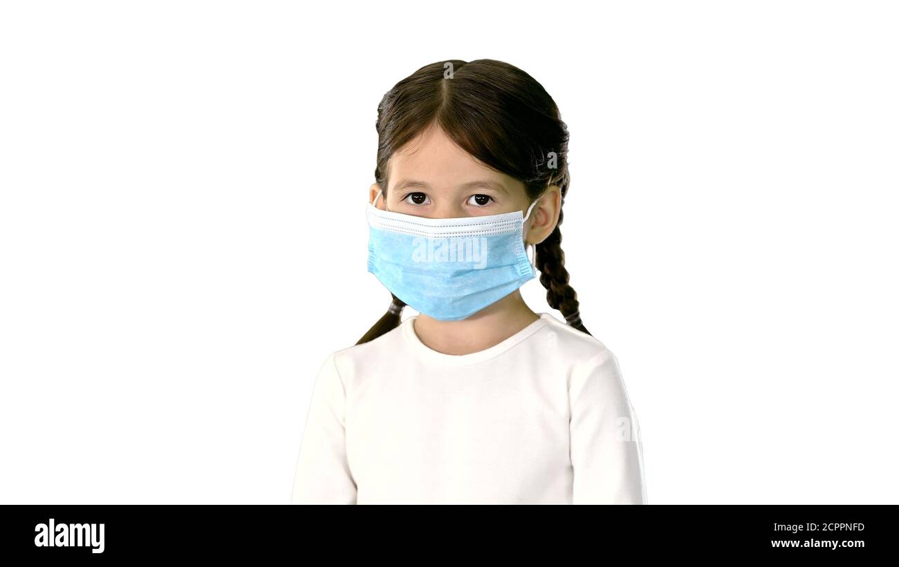 Little girl wearing protective face mask taking deep breaths loo Stock Photo