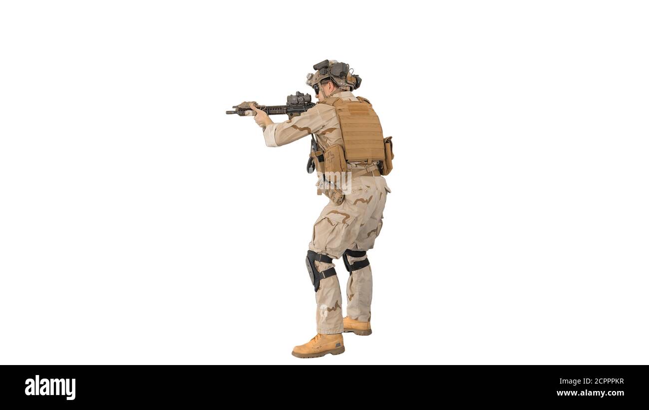Soldier aiming with an assault rifle on white background Stock Photo ...