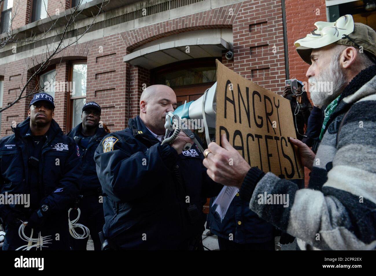 People participate in a protest against U.S. President Donald Trump's immigration policy and the recent Immigration and Customs Enforcement (ICE) raids in New York City, U.S. February 11, 2017. REUTERS/Stephanie Keith Stock Photo