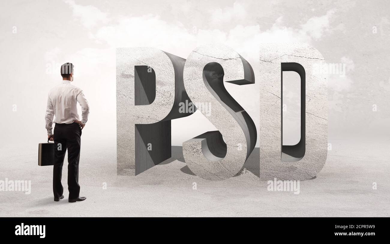 rear-view-of-a-businessman-standing-in-front-of-psd-abbreviation