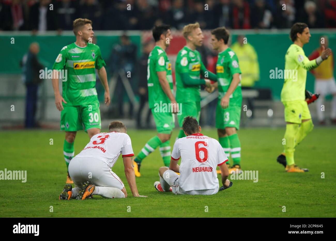 Soccer Football - DFB Cup Second Round - Fortuna Dusseldorf v Borussia Moenchengladbach - ESPRIT Arena, Dusseldorf, Germany - October 24, 2017   Fortuna Dusseldorf's Andre Hoffmann and Florian Neuhaus look dejected after the match         REUTERS/Wolfgang Rattay    DFB RULES PROHIBIT USE IN MMS SERVICES VIA HANDHELD DEVICES UNTIL TWO HOURS AFTER A MATCH AND ANY USAGE ON INTERNET OR ONLINE MEDIA SIMULATING VIDEO FOOTAGE DURING THE MATCH. Stock Photo