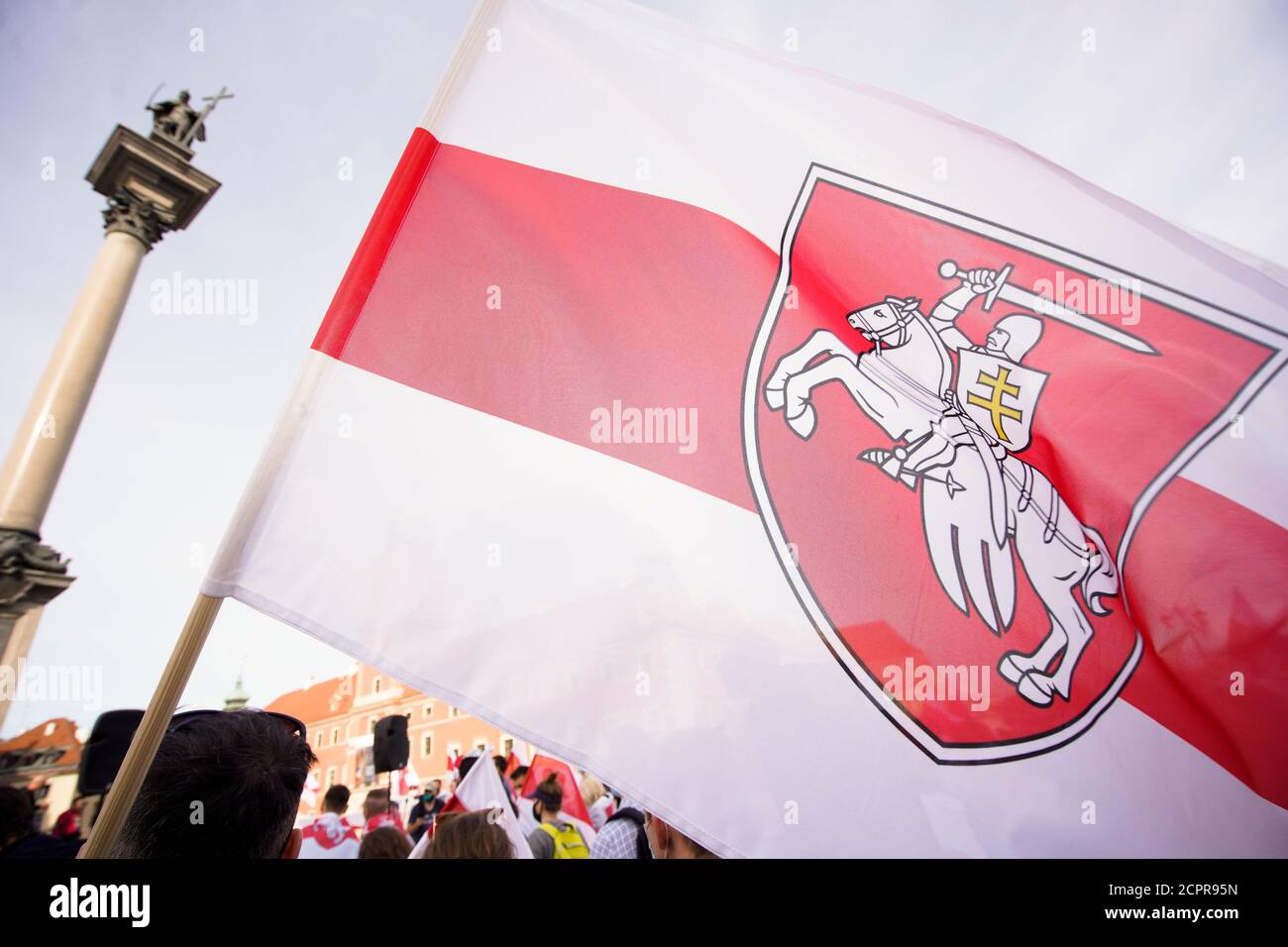 A man holds a Belarusian White-Red-White flag with the Pogon symbol in Warsaw, Poland on September 19, 2020. Several dozen people, mostly Belarusians Stock Photo