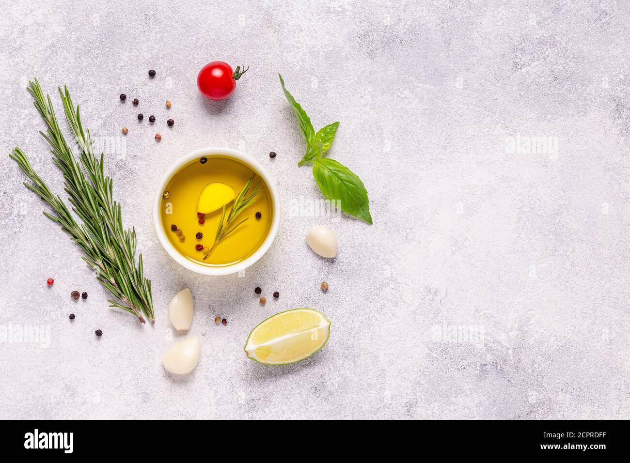Herbs and condiments on light stone background. Top view with copy ...