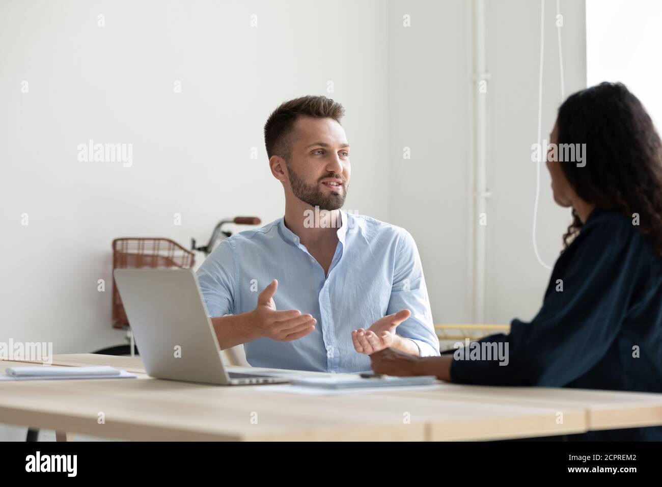 Small Discussing Diverse man woman discussing project hi-res stock photography and ...