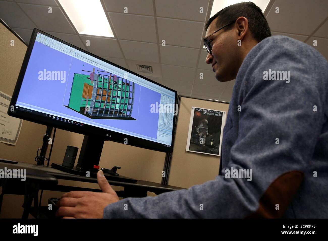 Product Development Engineer Jigar Patel works with a CAD image of a thrust reverser cascade in development at Oxford Performance Materials Inc., the maker of more than 600 parts to be used on Boeing's new Starliner manned spacecraft, in South Windsor, Connecticut, the maker of more than 600 parts to be used on Boeing's new Starliner manned spacecraft, in South Windsor, Connecticut, U.S., January 31, 2017. Picture taken January 31,2017. REUTERS/Mike Segar Stock Photo