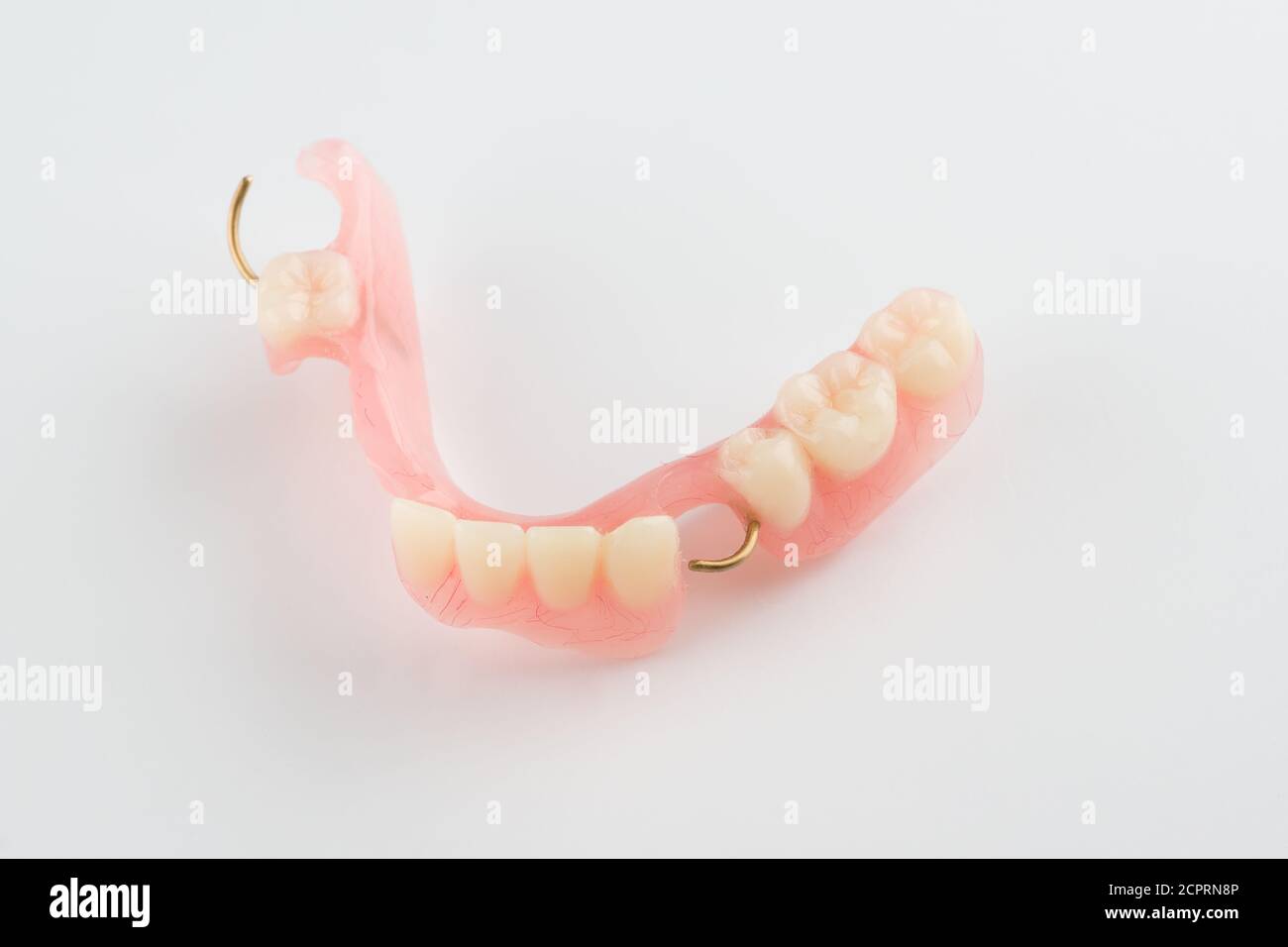 acrylic dental prosthesis with metal retaining elements Stock Photo