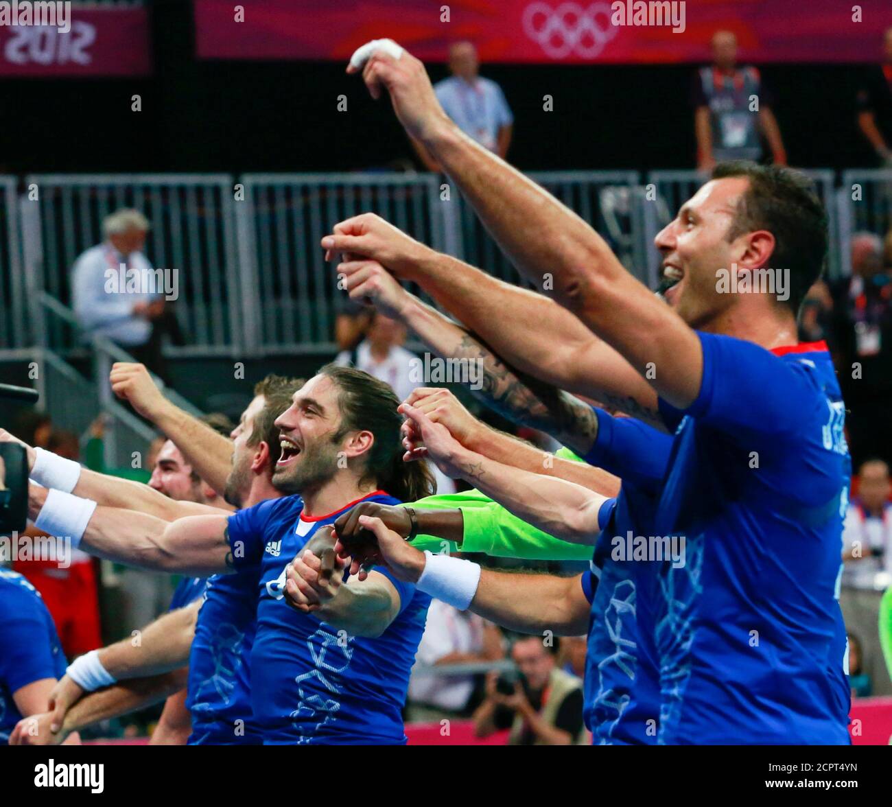 France's team players celebrate after defeating Croatia in their men's semi-final match at the Basketball Arena during the London 2012 Olympic Games August 10, 2012.            REUTERS/Adrees Latif (BRITAIN  - Tags: SPORT HANDBALL OLYMPICS) Stock Photo