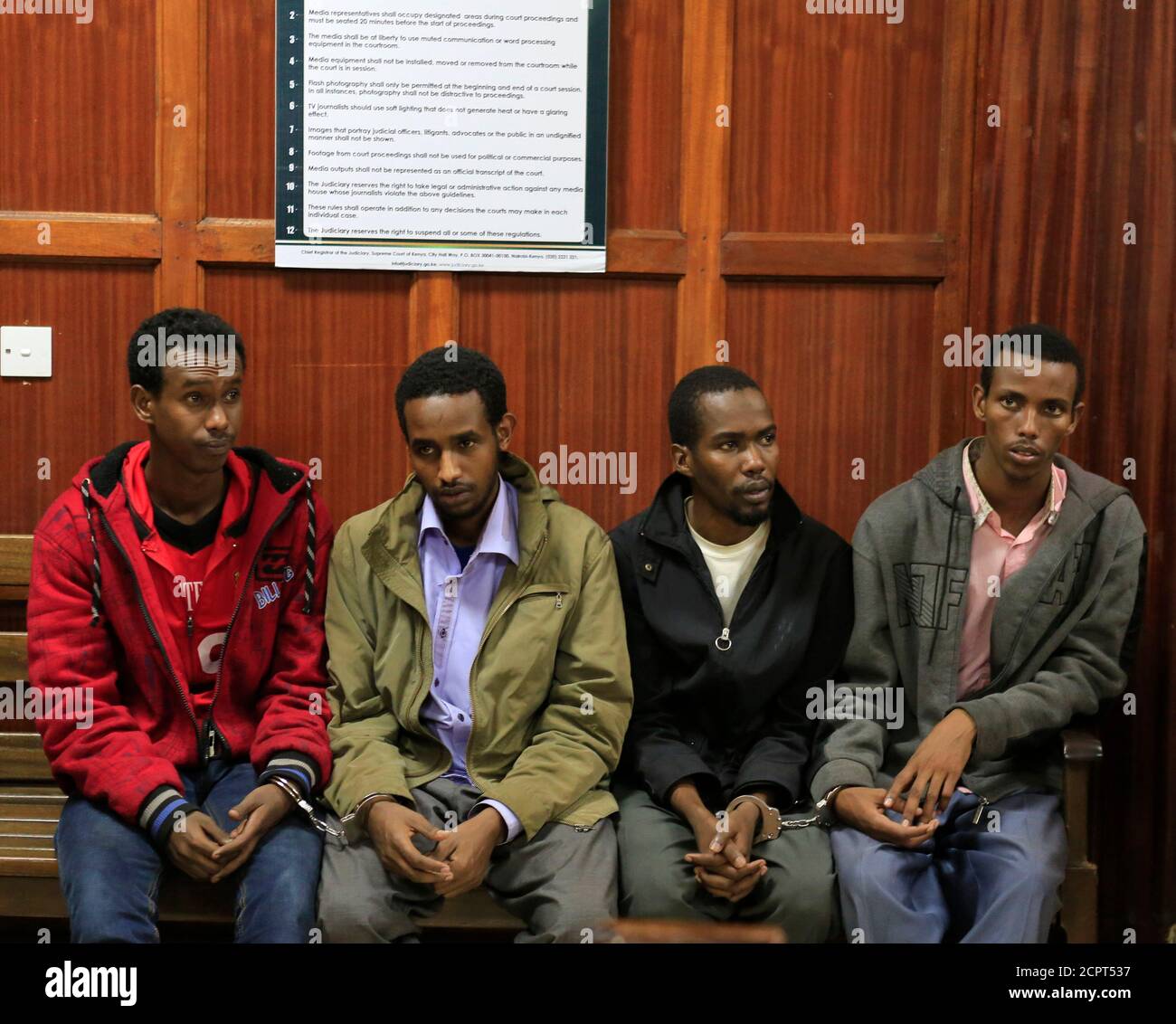 Somali men Mohamed Ahmed Abdi (L-R), Liban Abdullah Omar, Adan Mohamed Ibrahim and Hussein Hassan appear at the High Court for bail application in capital Nairobi 12, 2013. A Kenyan court charged the four Somali men last Monday with terrorist offences for helping al Qaeda-linked militants carry out an attack on a shopping mall in Nairobi that killed 67 people. Few details have emerged so far about the how the September attack was masterminded or how gunmen held off Kenyan security forces for four days in the Westgate mall. The assault was claimed by the Somali Islamist group al Shabaab. REUTER Stock Photo