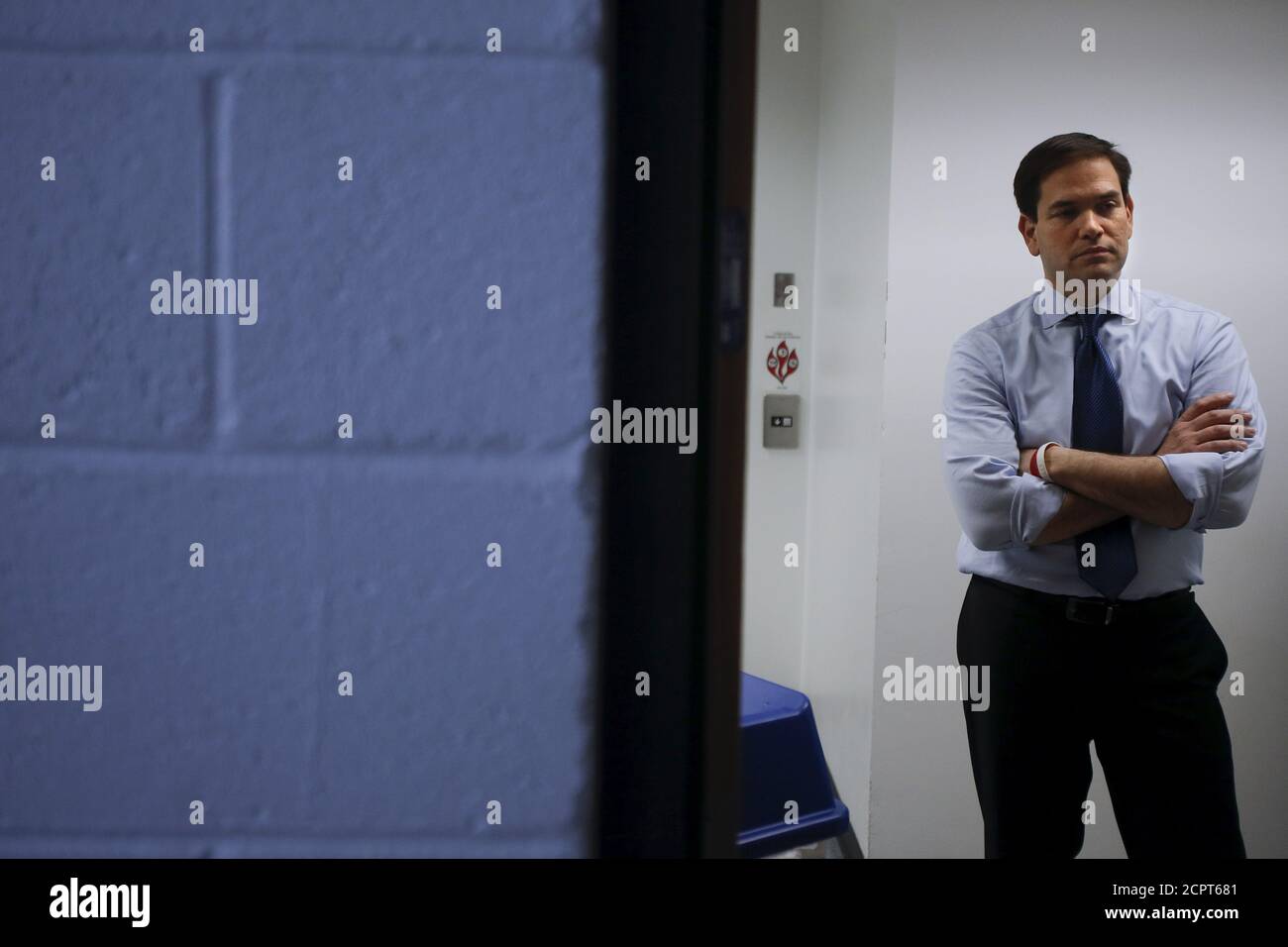 U.S. Senator and Republican presidential candidate Marco Rubio listens to the invocation from a backstage area before a campaign rally at Palm Beach Atlantic University in West Palm Beach, Florida, March 14, 2016.  REUTERS/Carlo Allegri Stock Photo