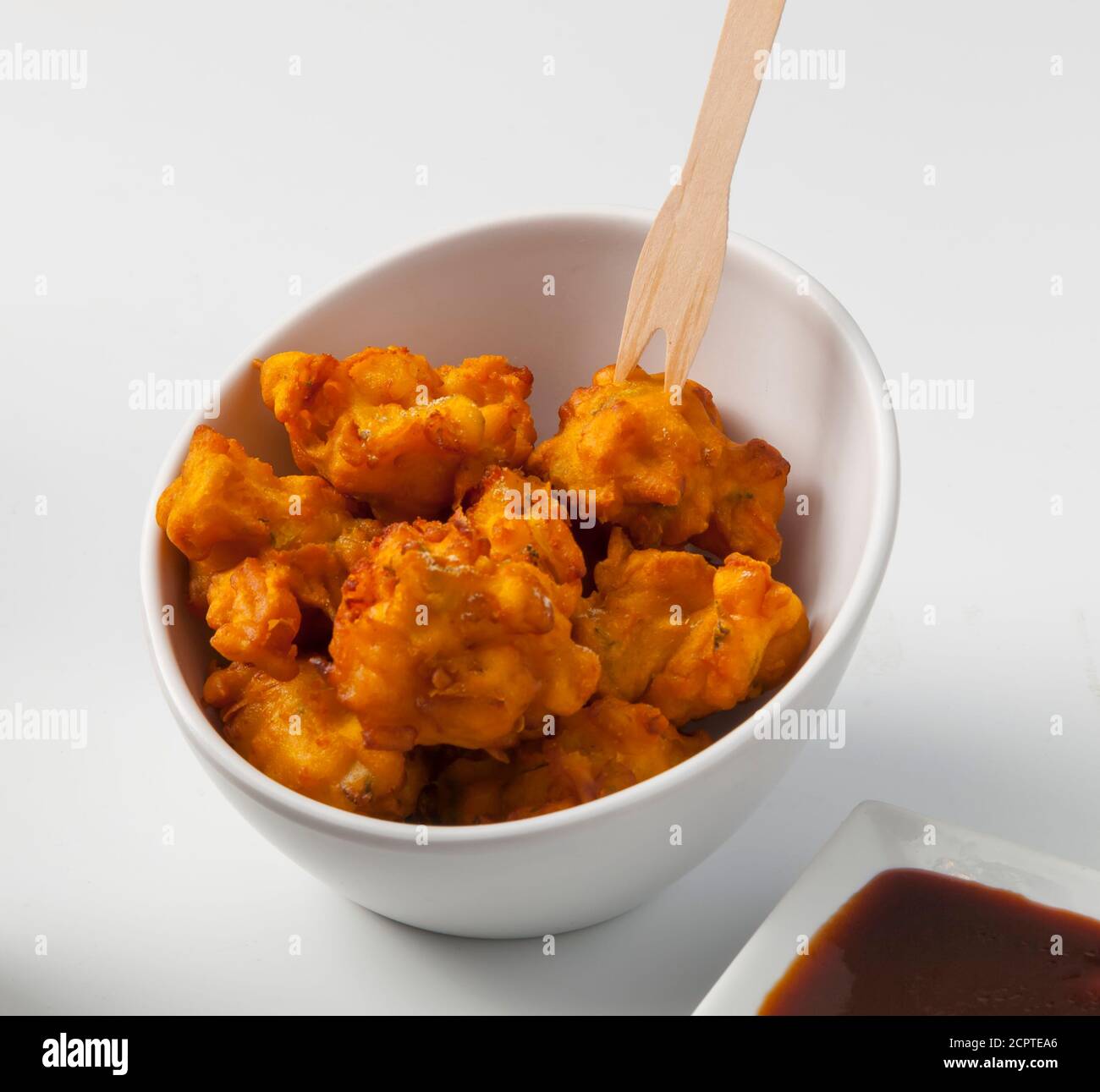 Indian pakora streetfood snack on white background Stock Photo