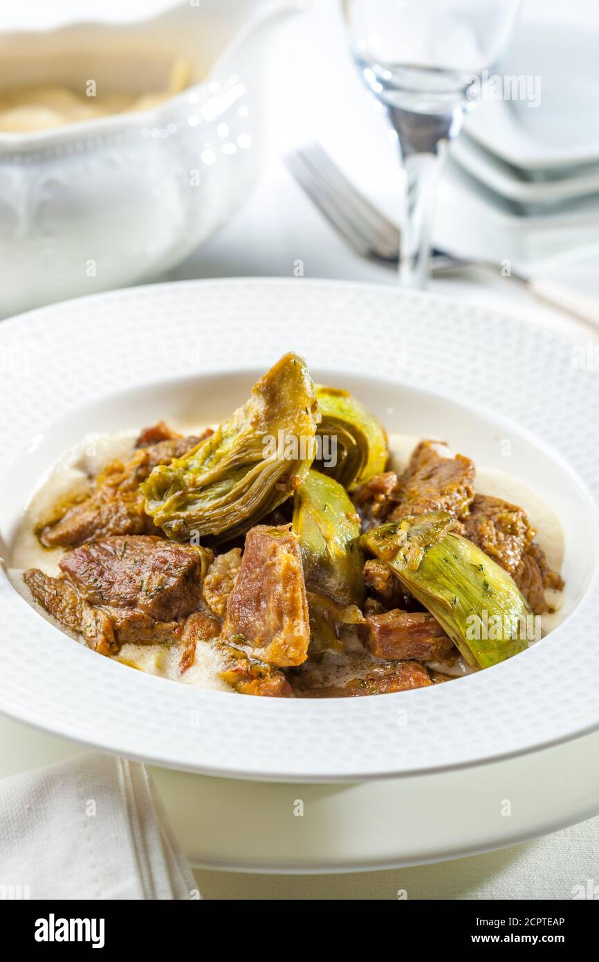 A delicious Greek dish of lamb with artichokes. Stock Photo